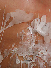 Hot candle wax on stud`s chest