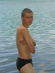 Handsome twink guy posing for the camera outdoors