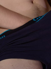 Yummy blond twink impregnates his deep belly button in front of the camera