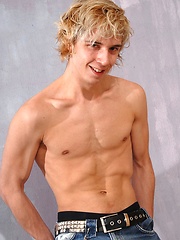 Cute blonde teen boy exposes his slim body