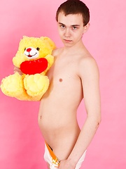 Straight guy Timmy Wright exposes his body with teddy in hands