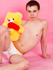 Straight guy Timmy Wright exposes his body with teddy in hands