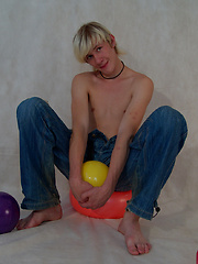 Blond twink Mark has fun with some balls on set, before getting his fat twink cock out for a play...